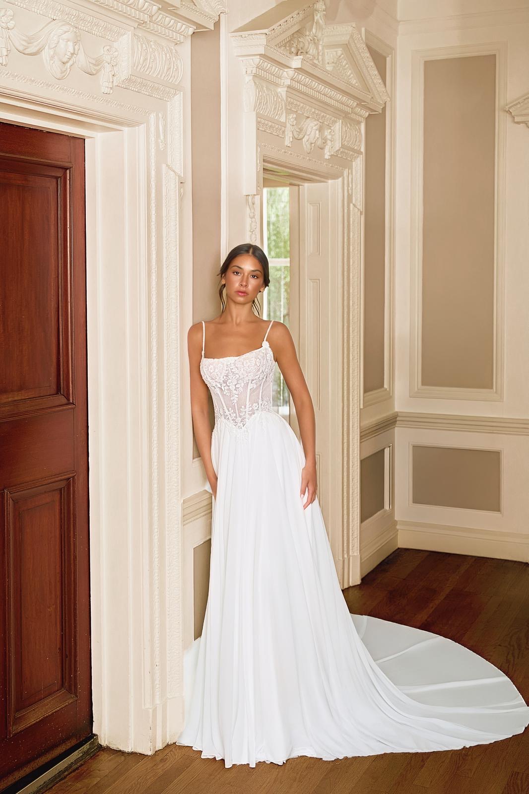 Bride in a lace wedding dress in an elegant interior