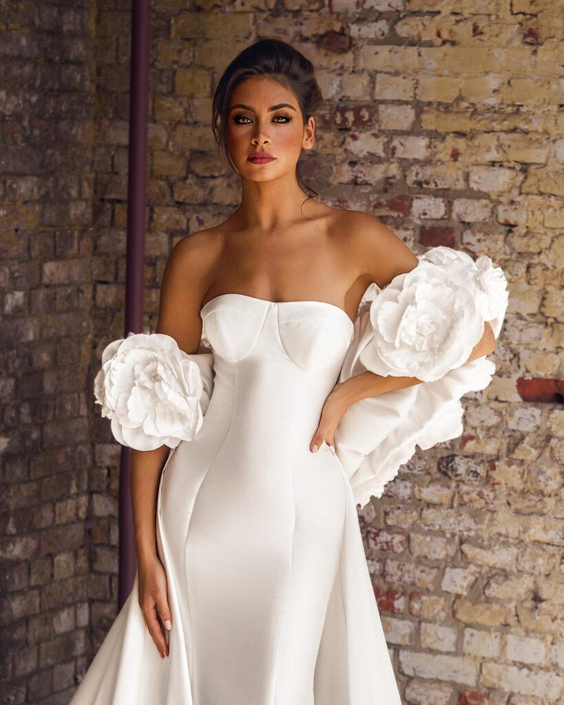 Bride wearing a sculptural modern wedding dress